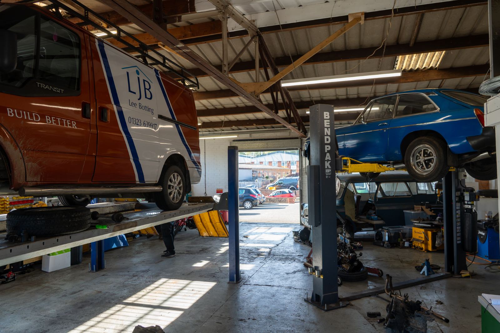 An LJB van on the four-post lift in the Pear Tree Garage workshop